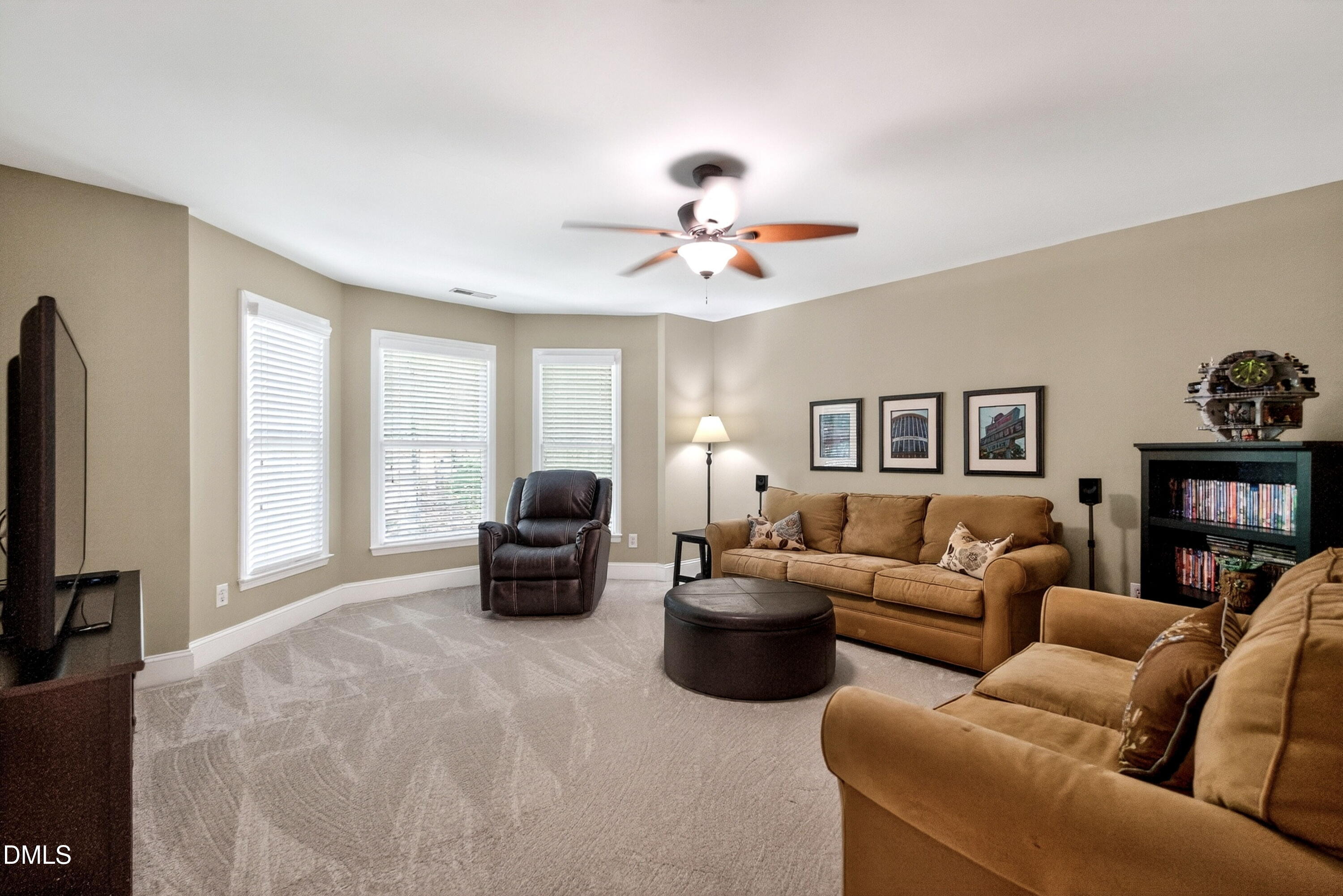 6329 Battleview Drive Raleigh, NC 27613 - Photo 22 of 36 a living room with furniture ceiling fan and a window