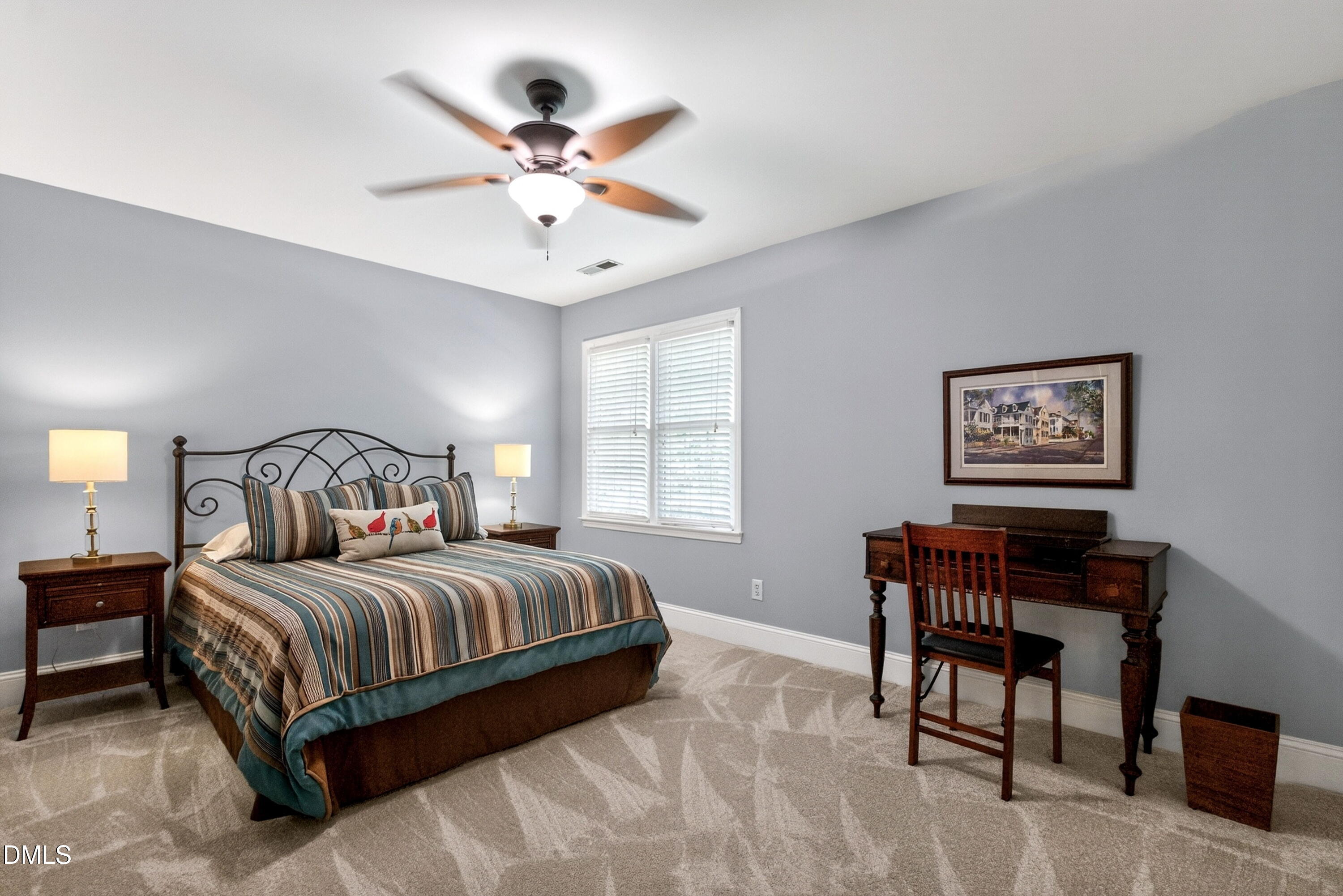 6329 Battleview Drive Raleigh, NC 27613 - Photo 23 of 36 a bedroom with a bed and a chandelier