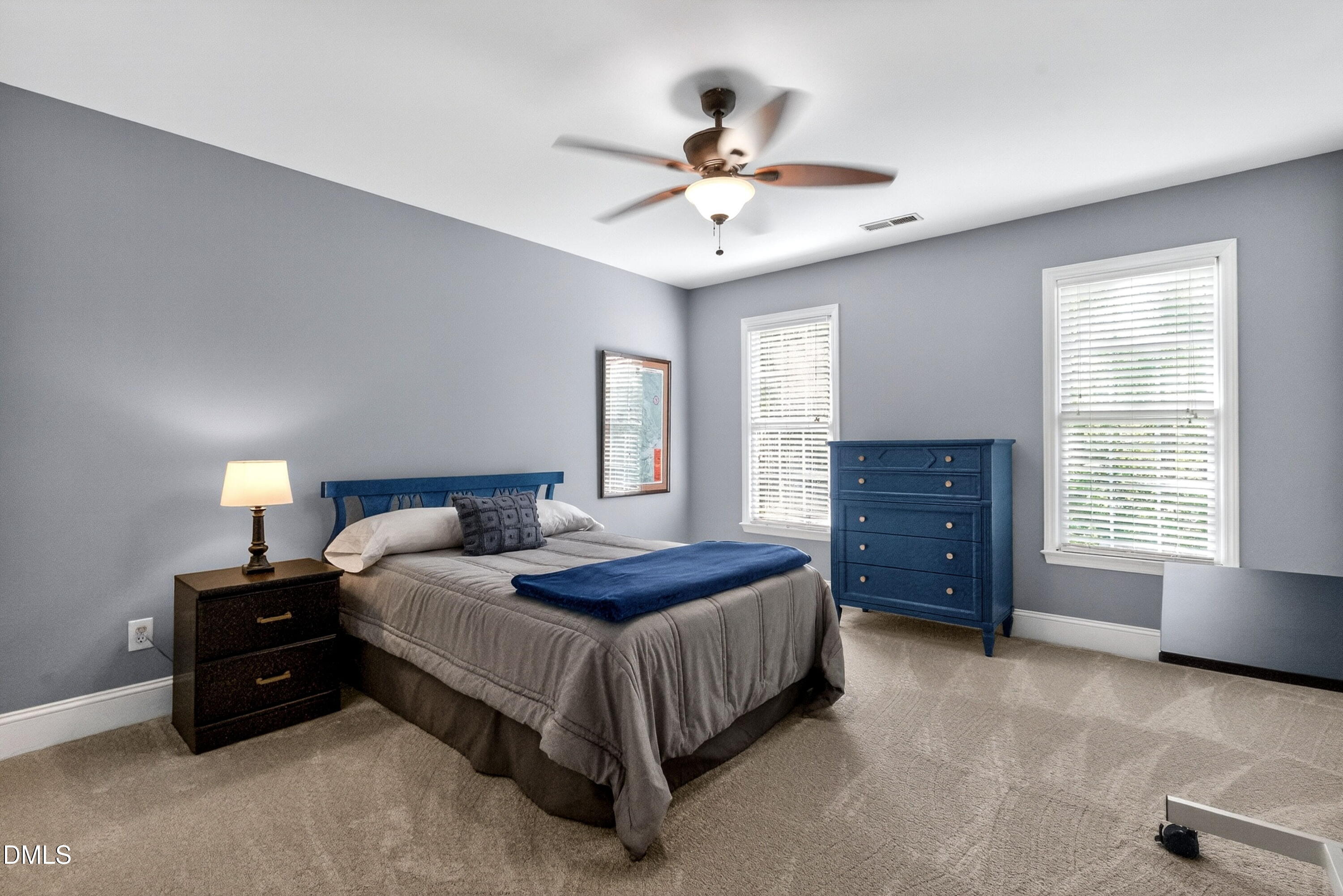 6329 Battleview Drive Raleigh, NC 27613 - Photo 25 of 36 a bedroom with a bed and window
