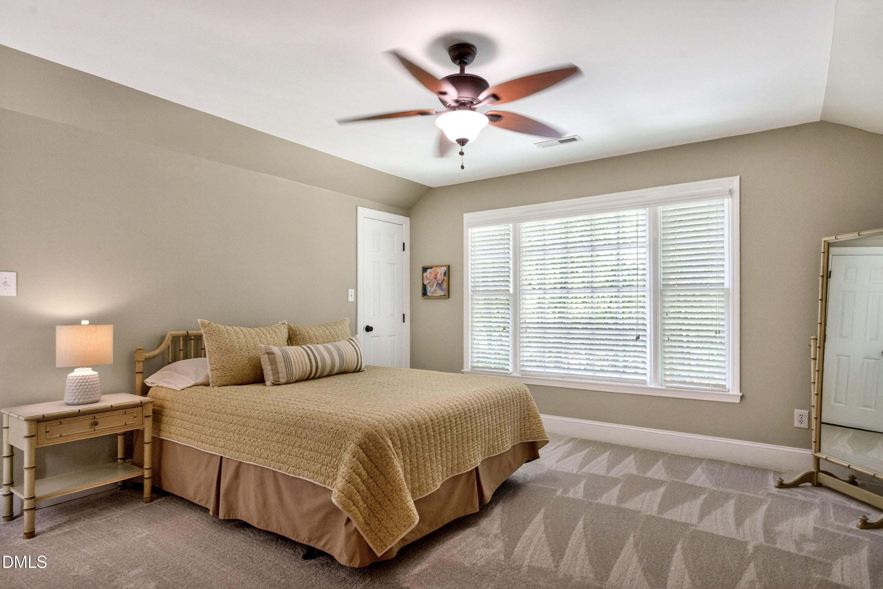 6329 Battleview Drive Raleigh, NC 27613 - Photo 27 of 36 a bedroom with a large bed and two window