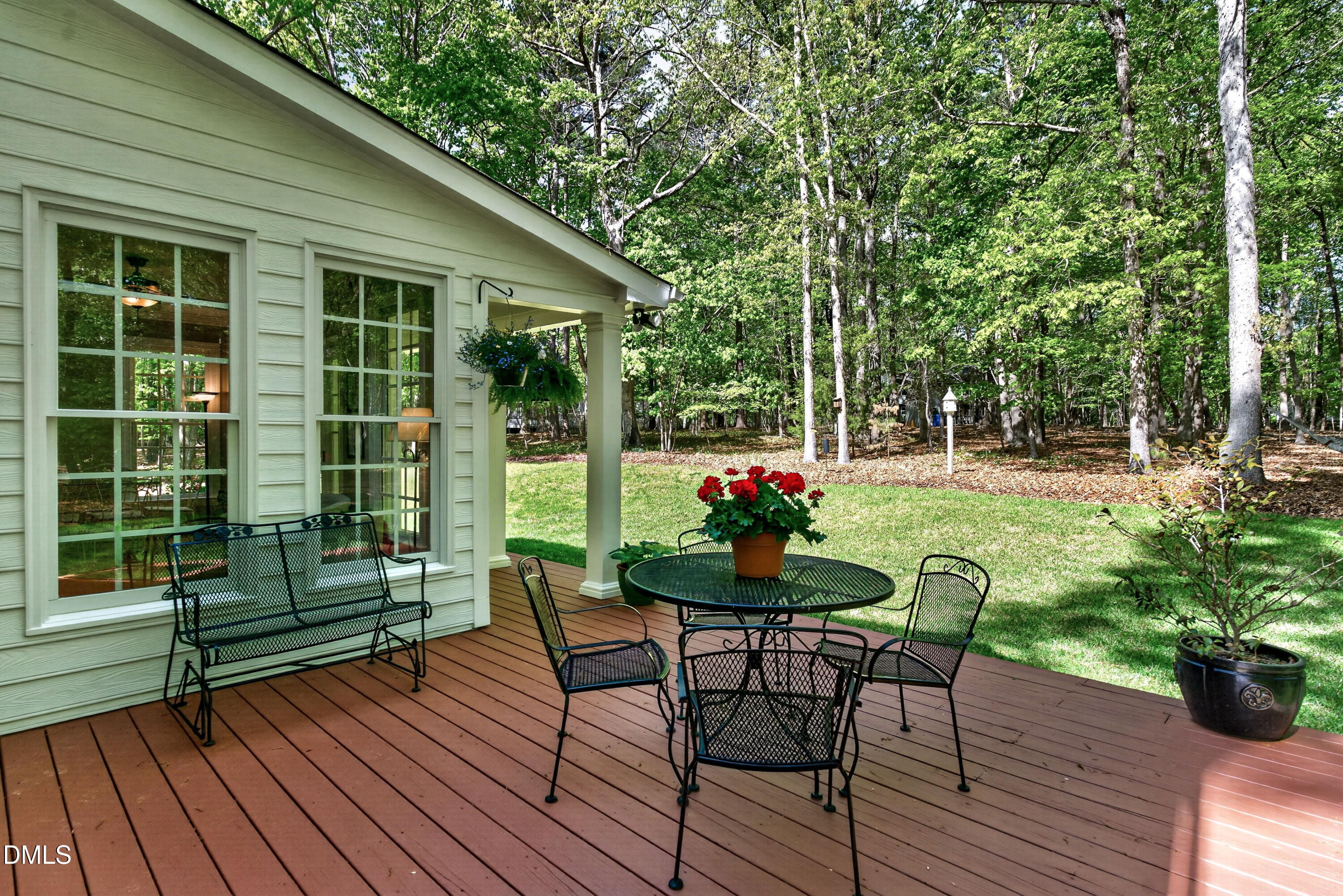 6329 Battleview Drive Raleigh, NC 27613 - Photo 29 of 36 a view of a house with backyard sitting area and garden