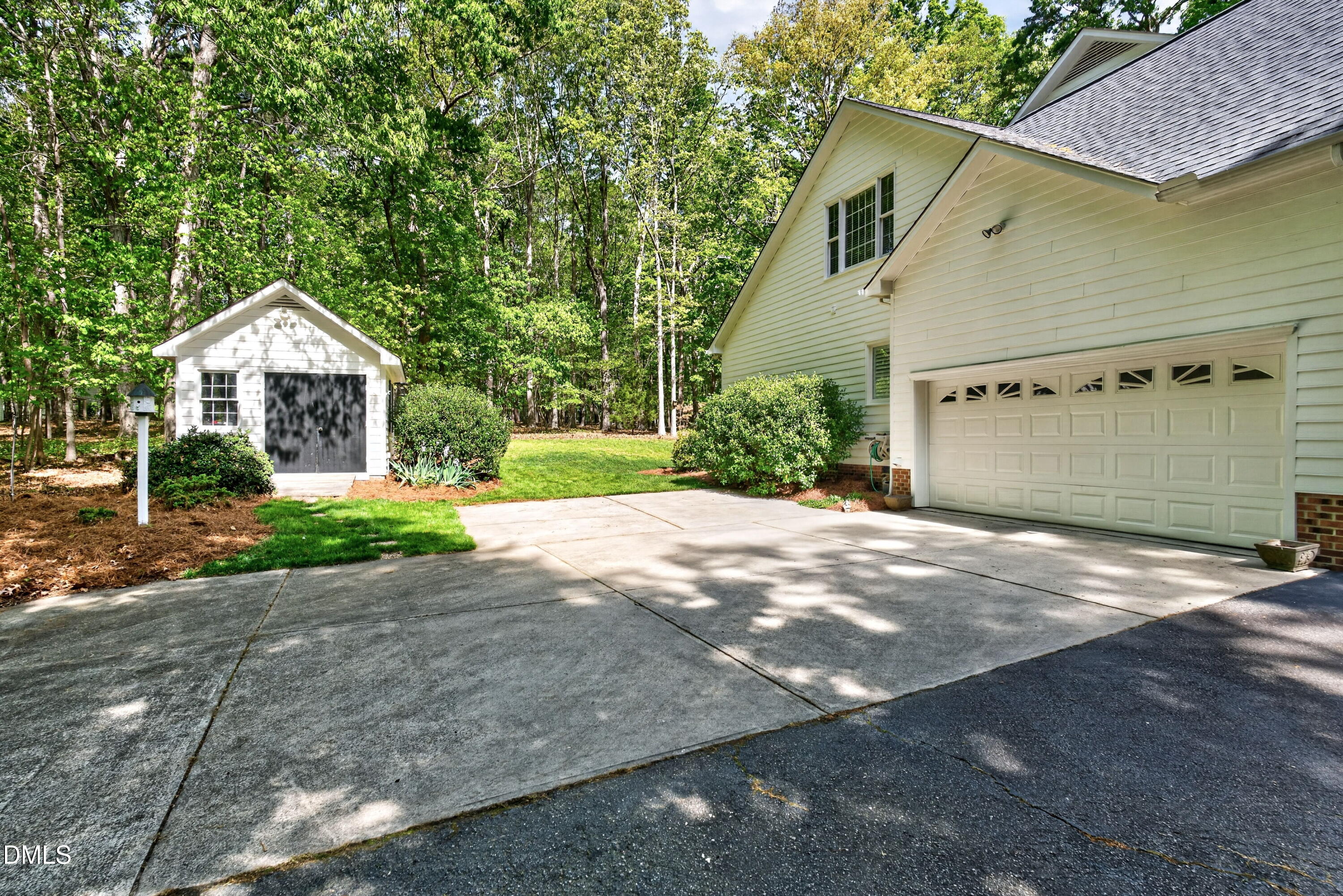 6329 Battleview Drive Raleigh, NC 27613 - Photo 32 of 36 a front view of a house with a yard and garage