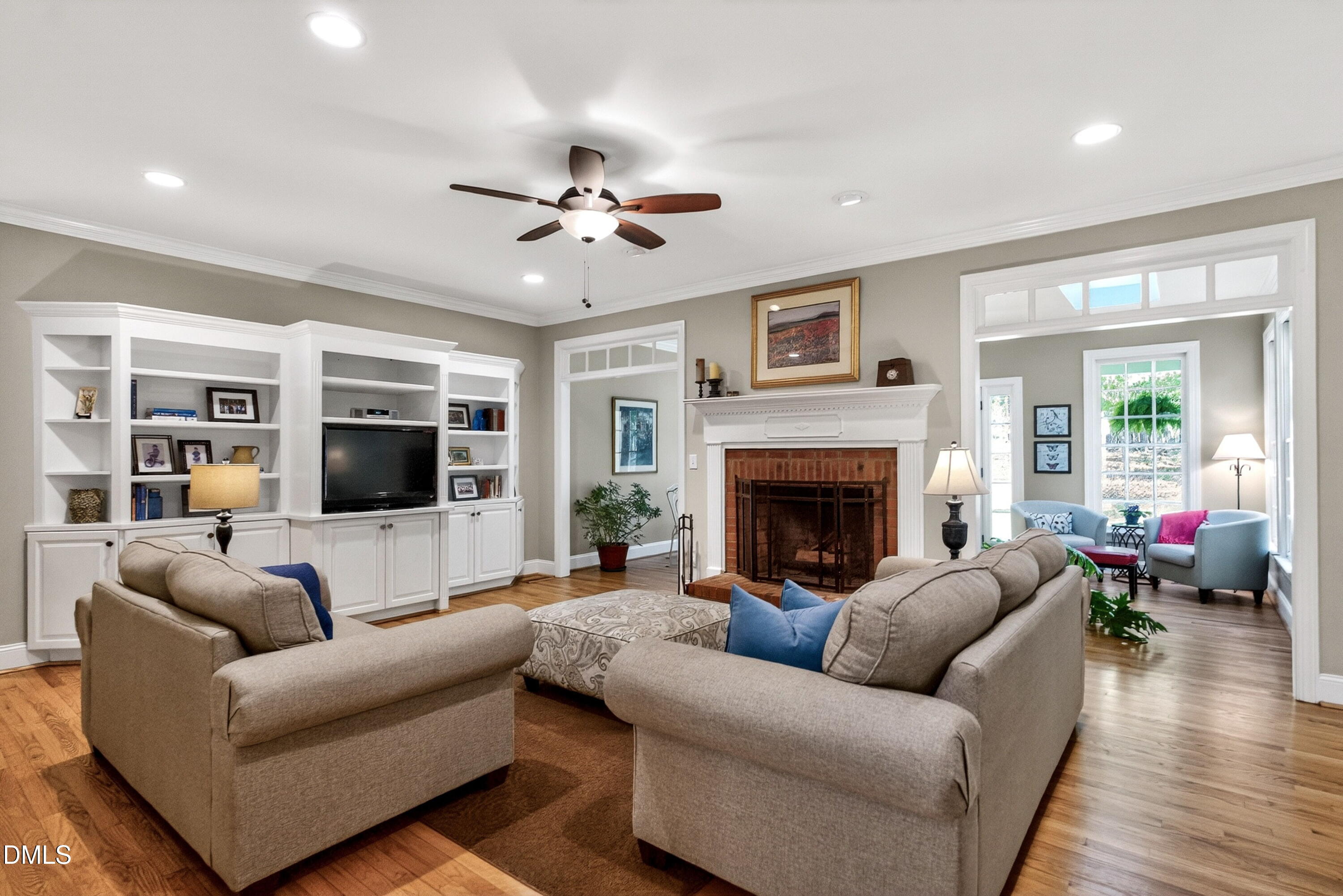 6329 Battleview Drive Raleigh, NC 27613 - Photo 10 of 36 a living room with furniture a flat screen tv and a fireplace