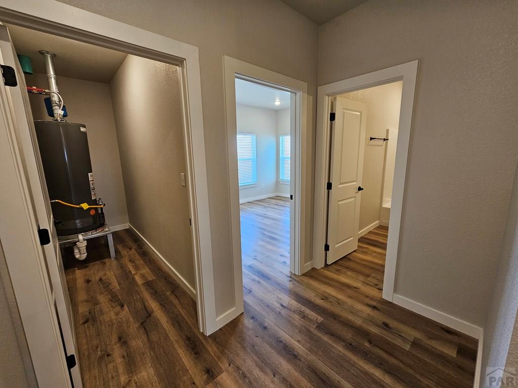 28655 County Road 24.6 Springfield, CO 81073 - Photo 11 of 19 a view of a hallway with wooden floor and staircase