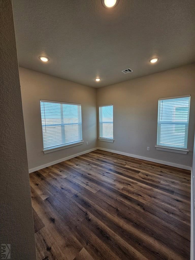 28655 County Road 24.6 Springfield, CO 81073 - Photo 14 of 19 a view of an empty room with wooden floor and a window