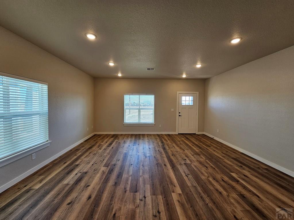28655 County Road 24.6 Springfield, CO 81073 - Photo 3 of 19 a view of empty room with wooden floor and fan
