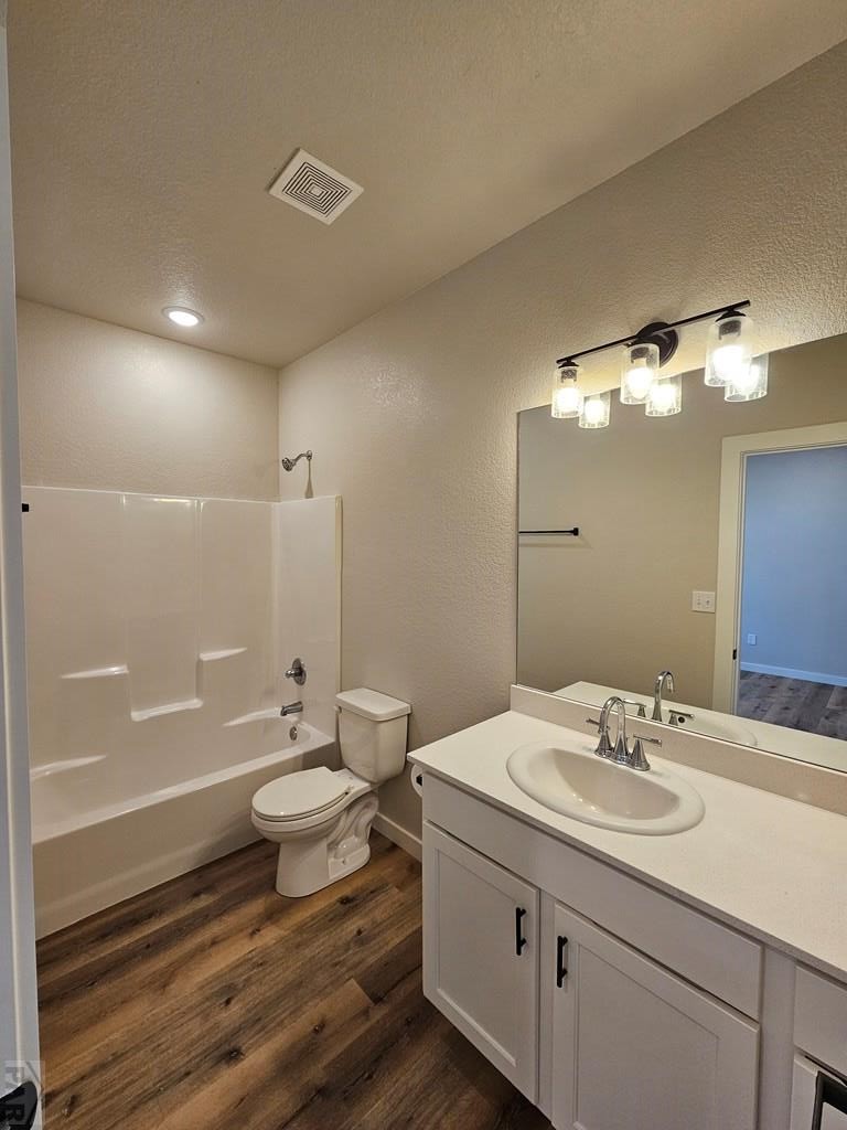 28655 County Road 24.6 Springfield, CO 81073 - Photo 10 of 19 a bathroom with a granite countertop sink toilet a large mirror a bathtub and shower