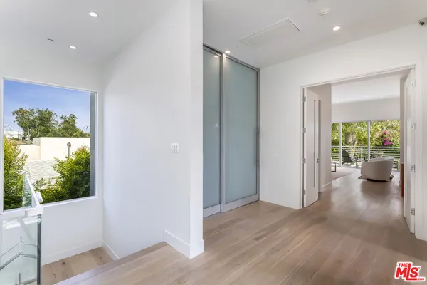 a view of a living room and wooden floor