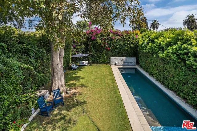 a spacious bathroom with double vanity sink and a mirror
