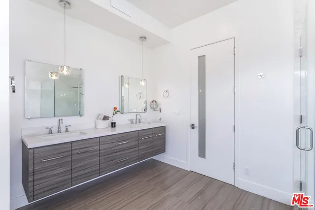 a bathroom with a tub shower and window