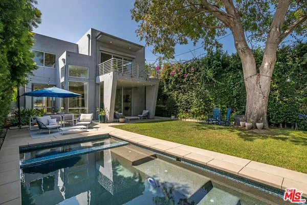 a view of a house with a swimming pool