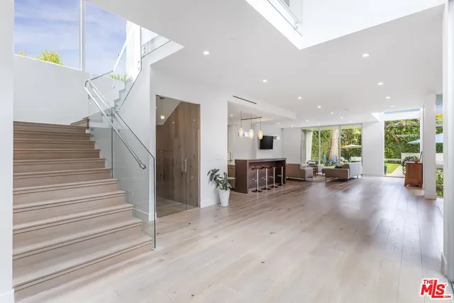 a view of a living room and entryway