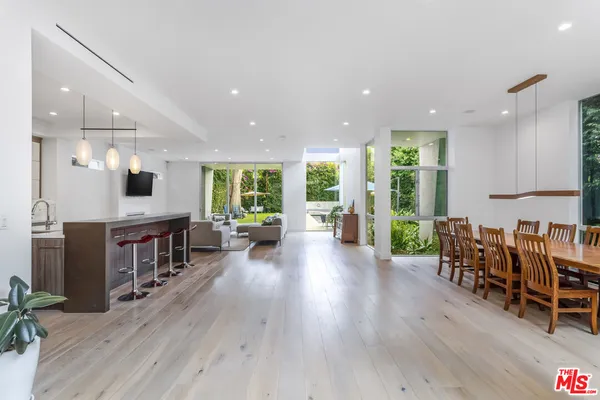 an open kitchen with a table and chairs in it