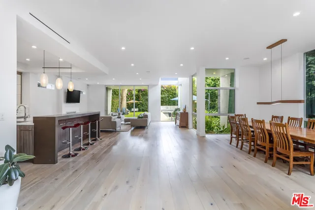 an open kitchen with a table and chairs in it