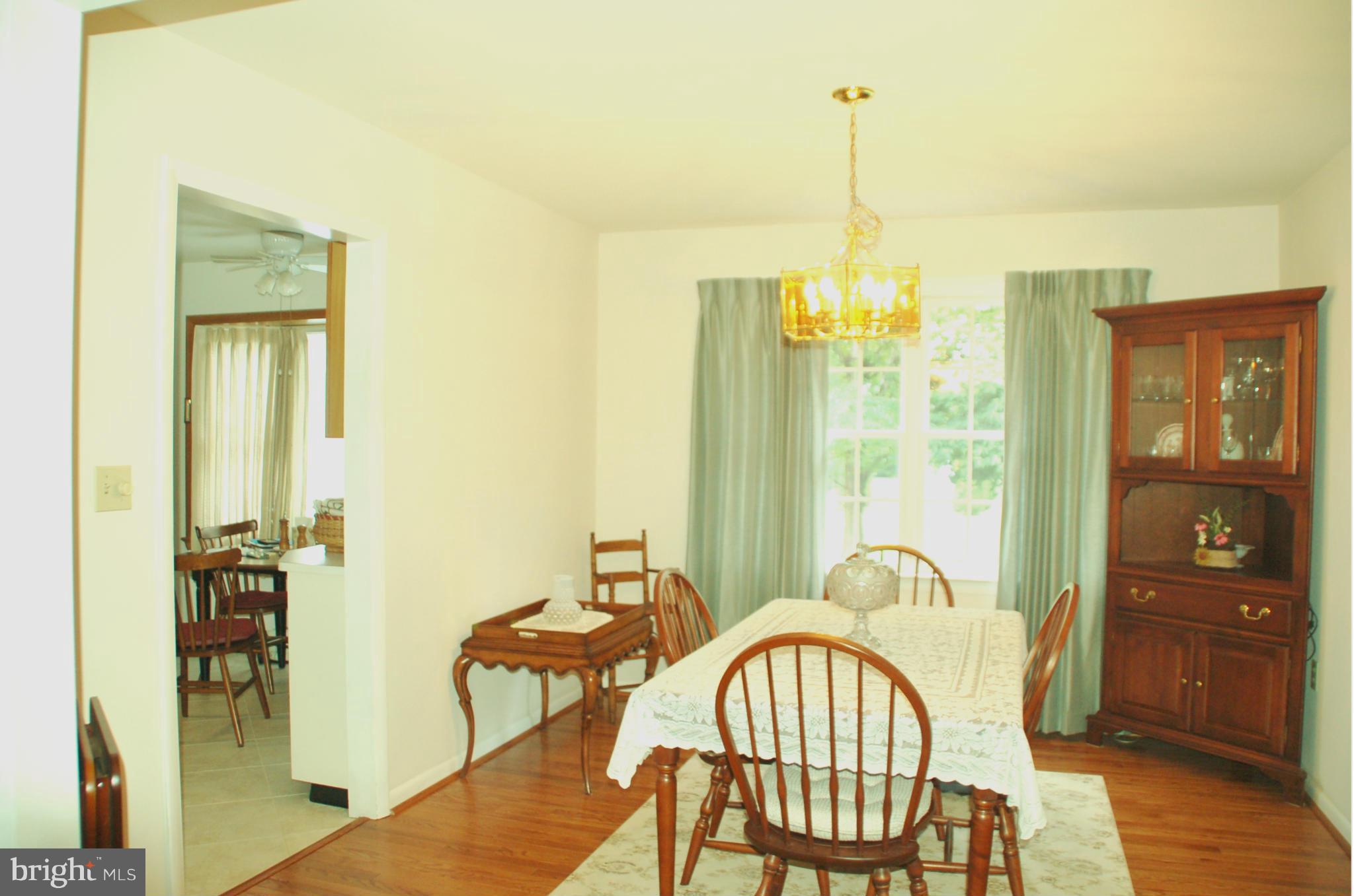 8059 Stone Ridge Drive Frederick, MD 21702 - Photo 9 of 29 Dining room has HW floors
