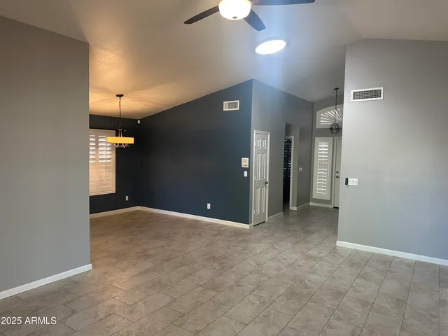 a kitchen with a granite countertop refrigerator and a sink