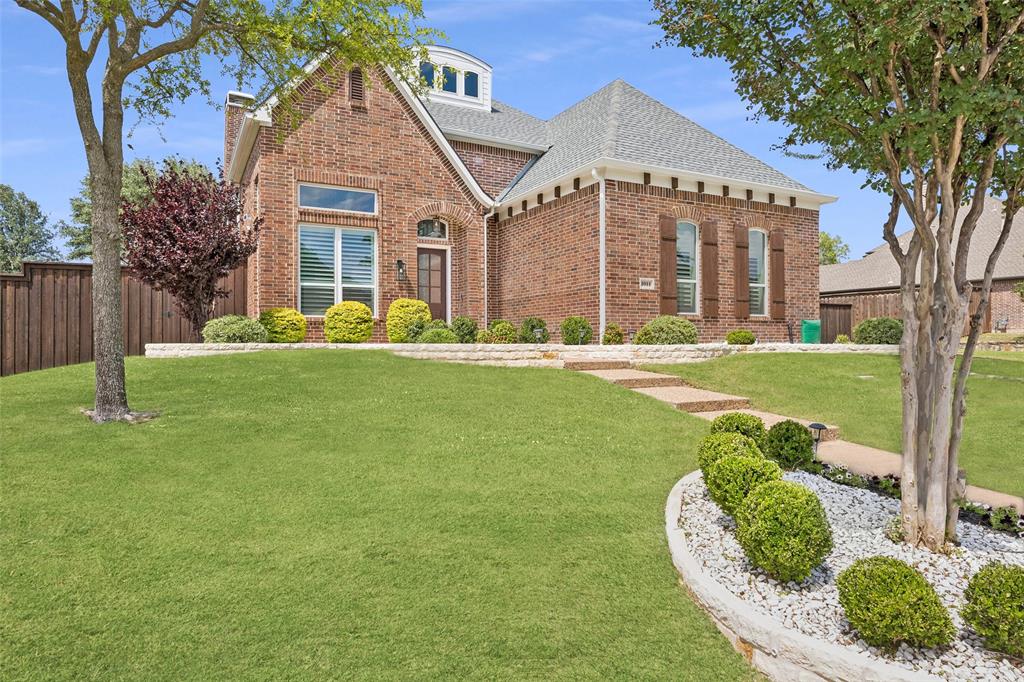 1011 Three Rivers Drive Prosper, TX 75078 - Photo 6 of 27 Timeless brick elevation with mature landscaping and inviting curb appeal.