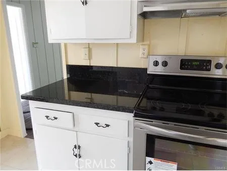 a close view of a sink a vanity and a window