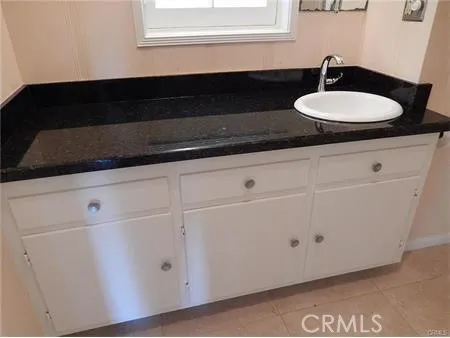 a view of balcony with dining table and chairs