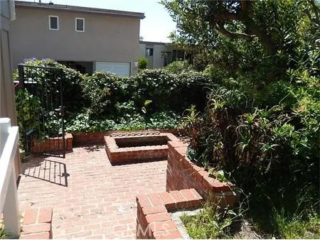 a balcony with wooden floor and outdoor space