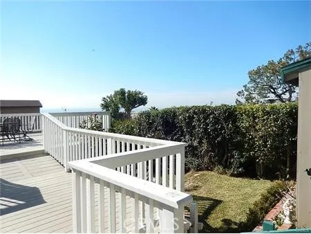 a view of a wooden fence with a bench