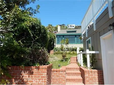a front view of a house with a deck