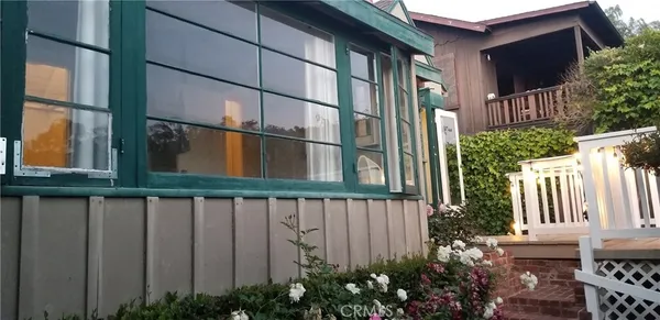 a view of a chair and table in the balcony