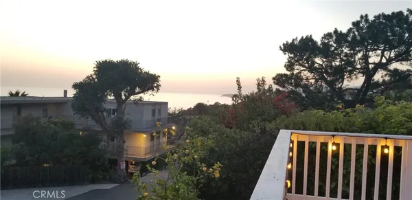 a view of a lake and sunset