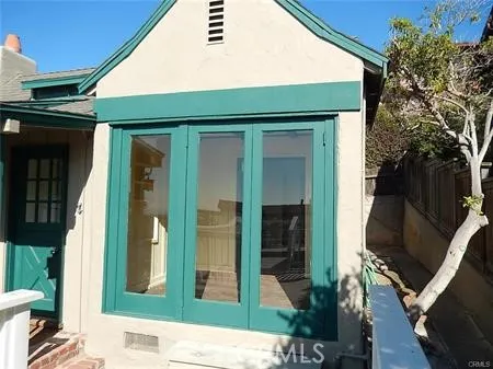 a room with a fireplace and a ceiling fan