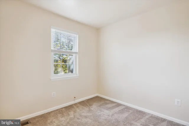 a bathroom with a sink toilet vanity and shower