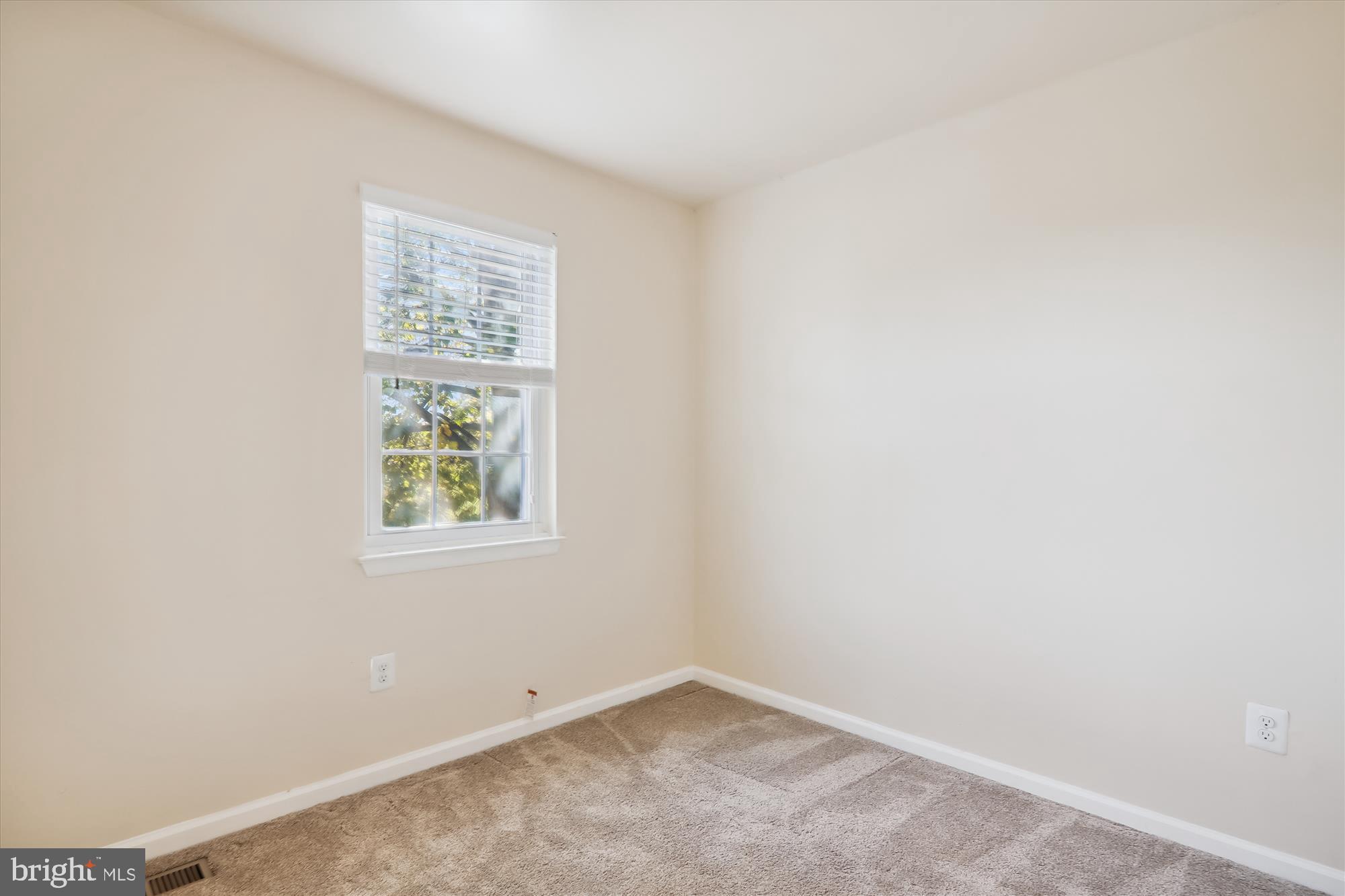 13164 Musicmaster Drive, Unit 144 Silver Spring, MD 20904 - Photo 15 of 31 an empty room with windows