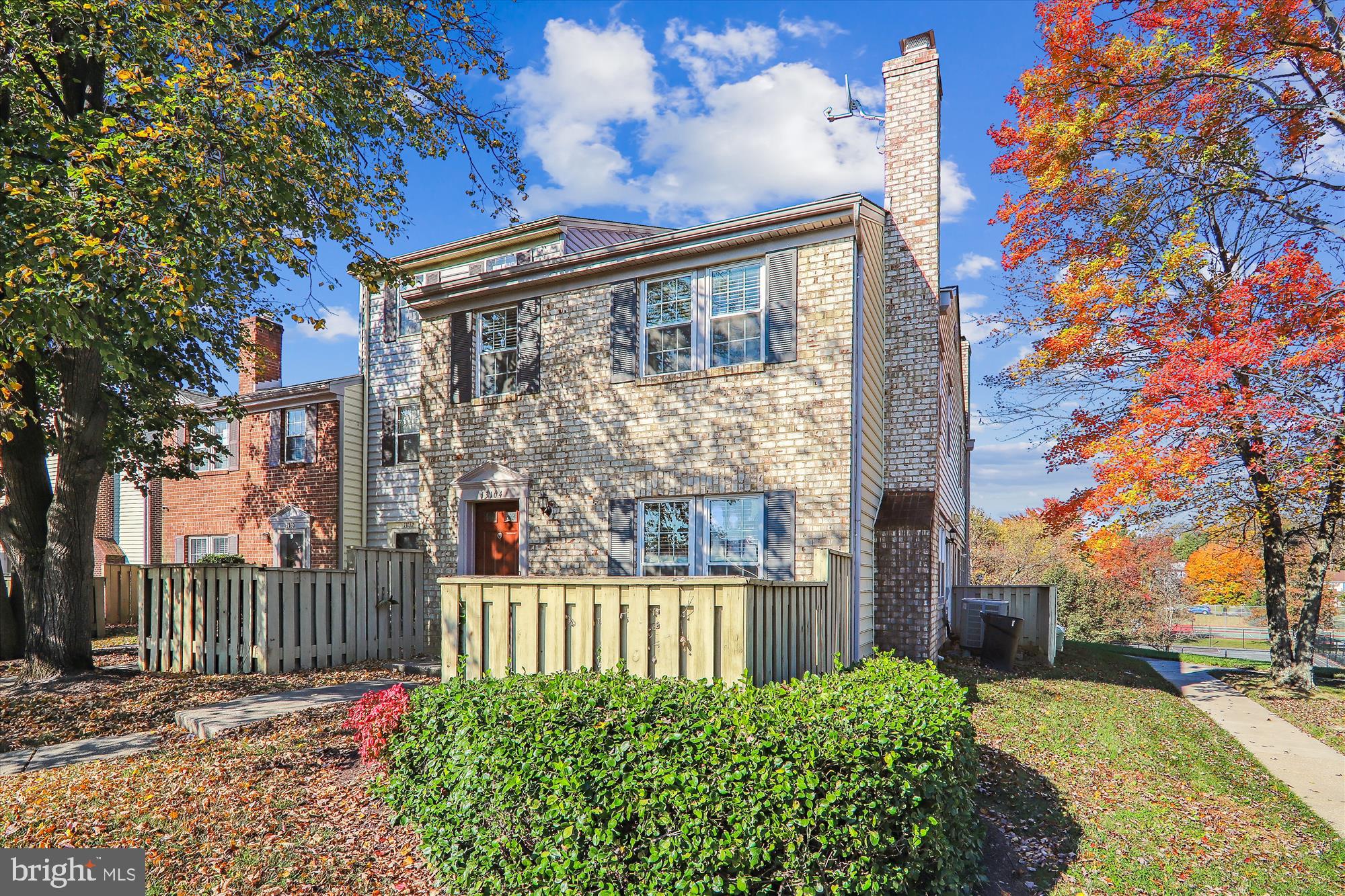 13164 Musicmaster Drive, Unit 144 Silver Spring, MD 20904 - Photo 17 of 31 a view of a house with a small yard plants and large tree