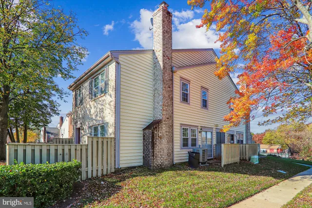 a view of a brick house with a large window