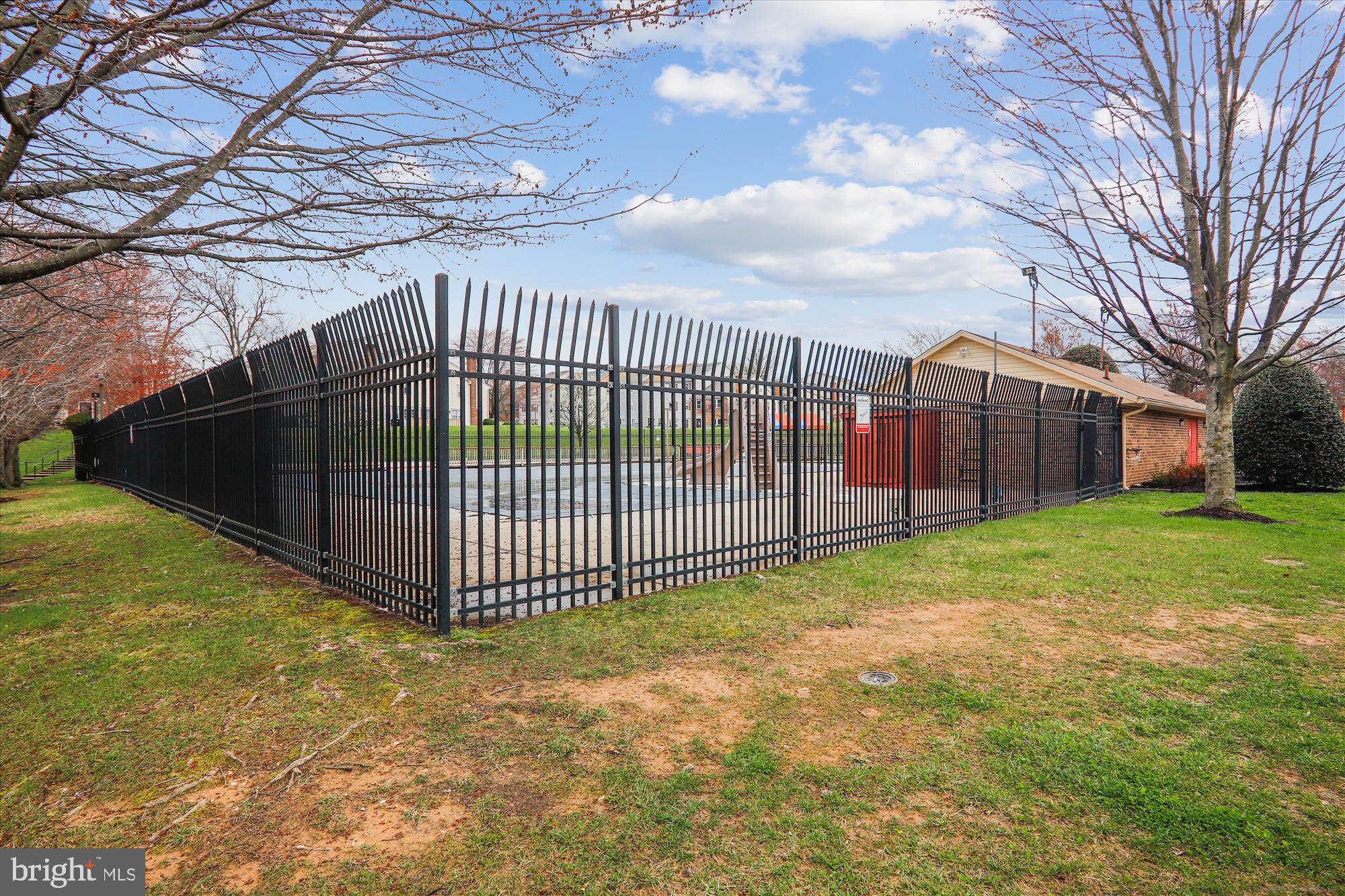 13164 Musicmaster Drive, Unit 144 Silver Spring, MD 20904 - Photo 22 of 31 a view of a backyard with a large tree