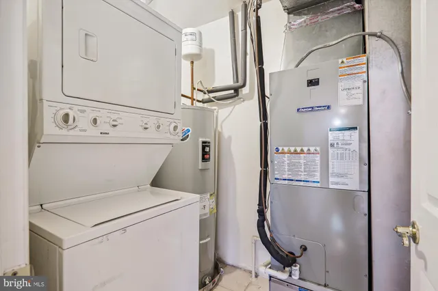 a view of a chairs and table under an umbrella