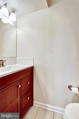 a bathroom with a sink and mirror