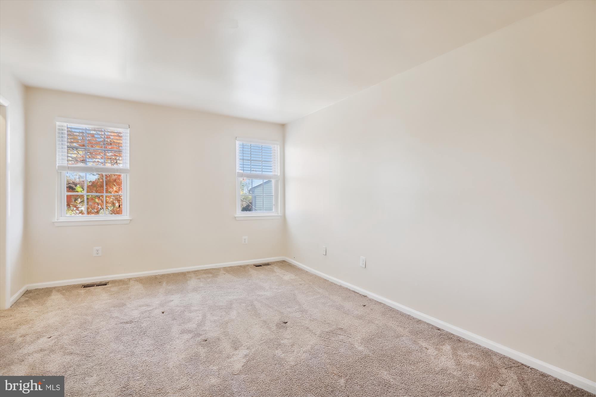 13164 Musicmaster Drive, Unit 144 Silver Spring, MD 20904 - Photo 10 of 31 an empty room with windows