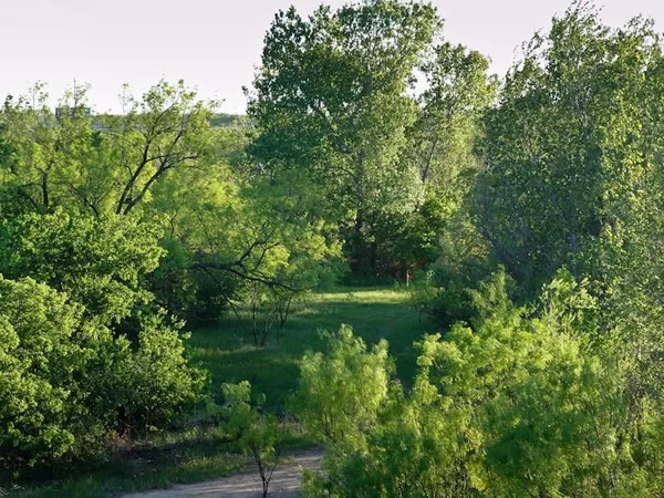 a view of a lake with a yard