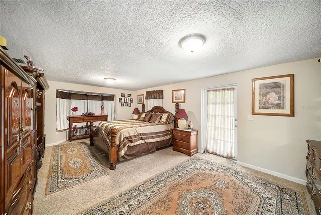 a bed room with a bed and a window