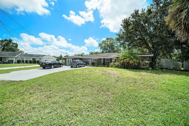 a view of a house with a big yard