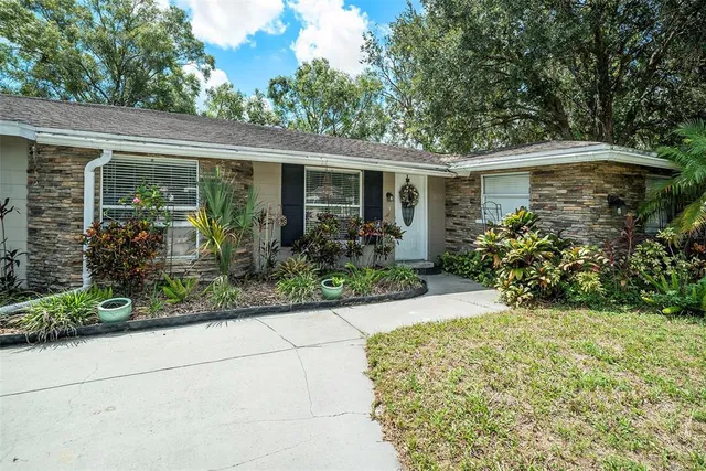 front view of a house with a garden