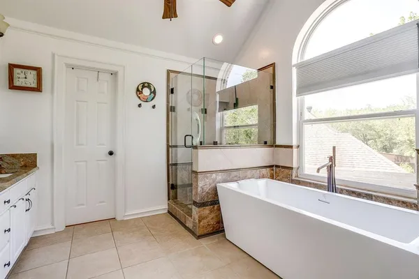a bathroom with a bathtub and a sink