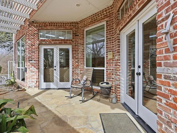 a front view of a house with outdoor seating
