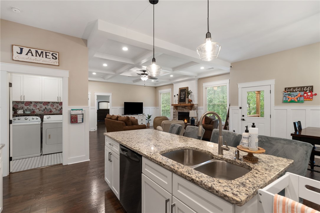 201 Hearthstone Drive Anderson, SC 29621 - Photo 20 of 49 A luminous living space features coffered ceilings, hardwood floors, and a well-appointed kitchen island.