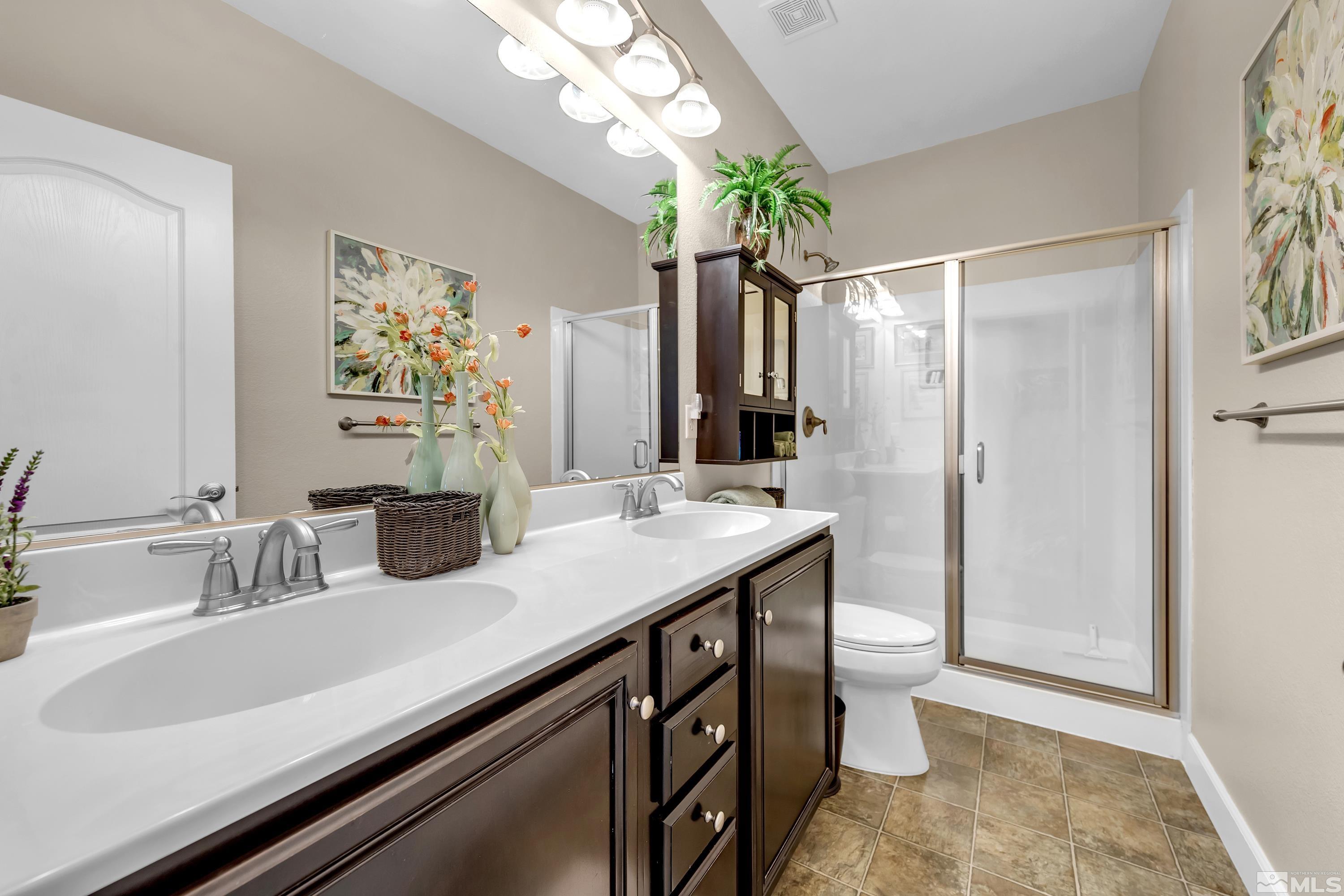 420 Manciano Way Reno, NV 89521 - Photo 17 of 30 a bathroom with a sink and a mirror