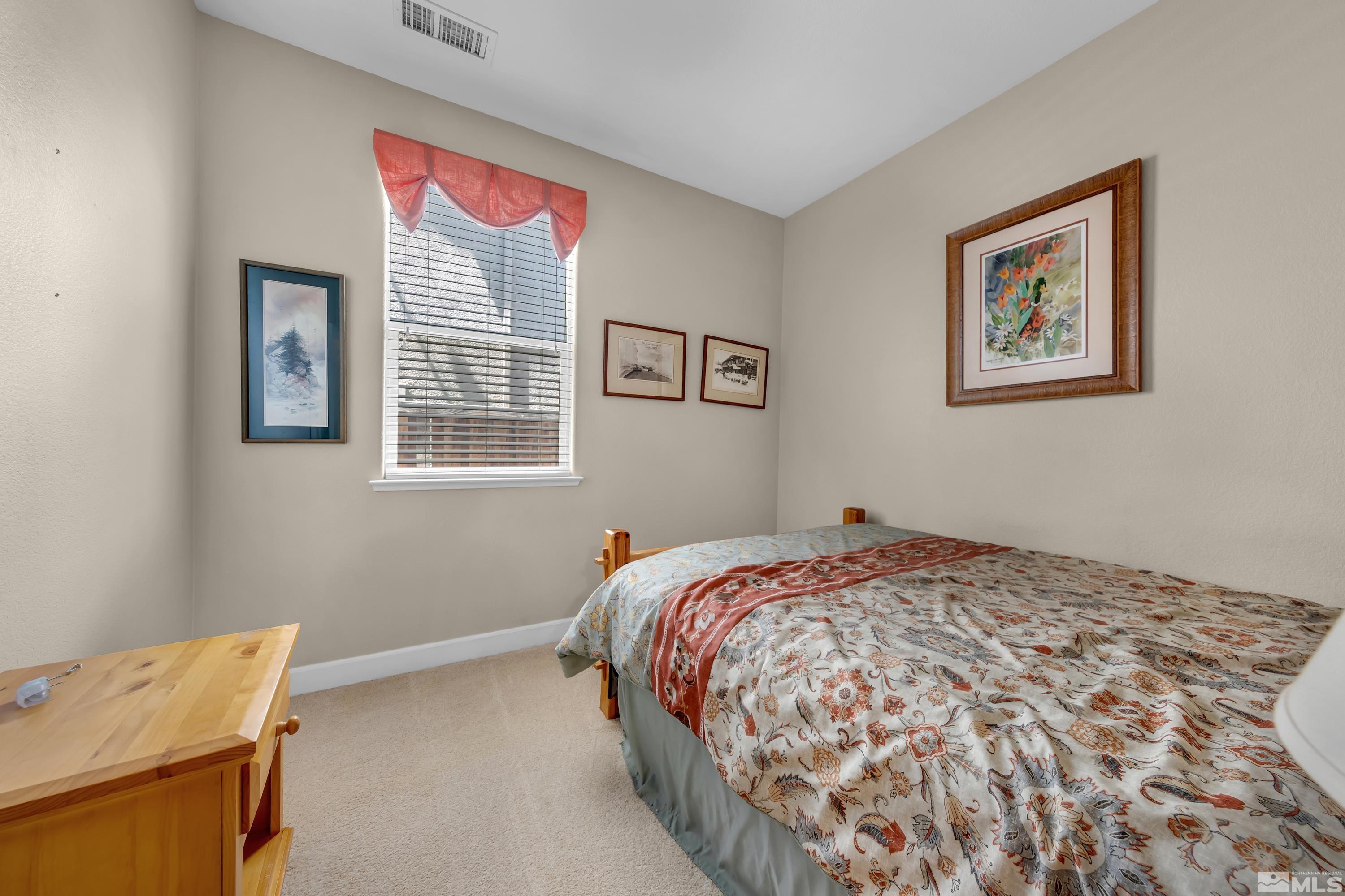 420 Manciano Way Reno, NV 89521 - Photo 20 of 30 a bedroom with a bed and a window
