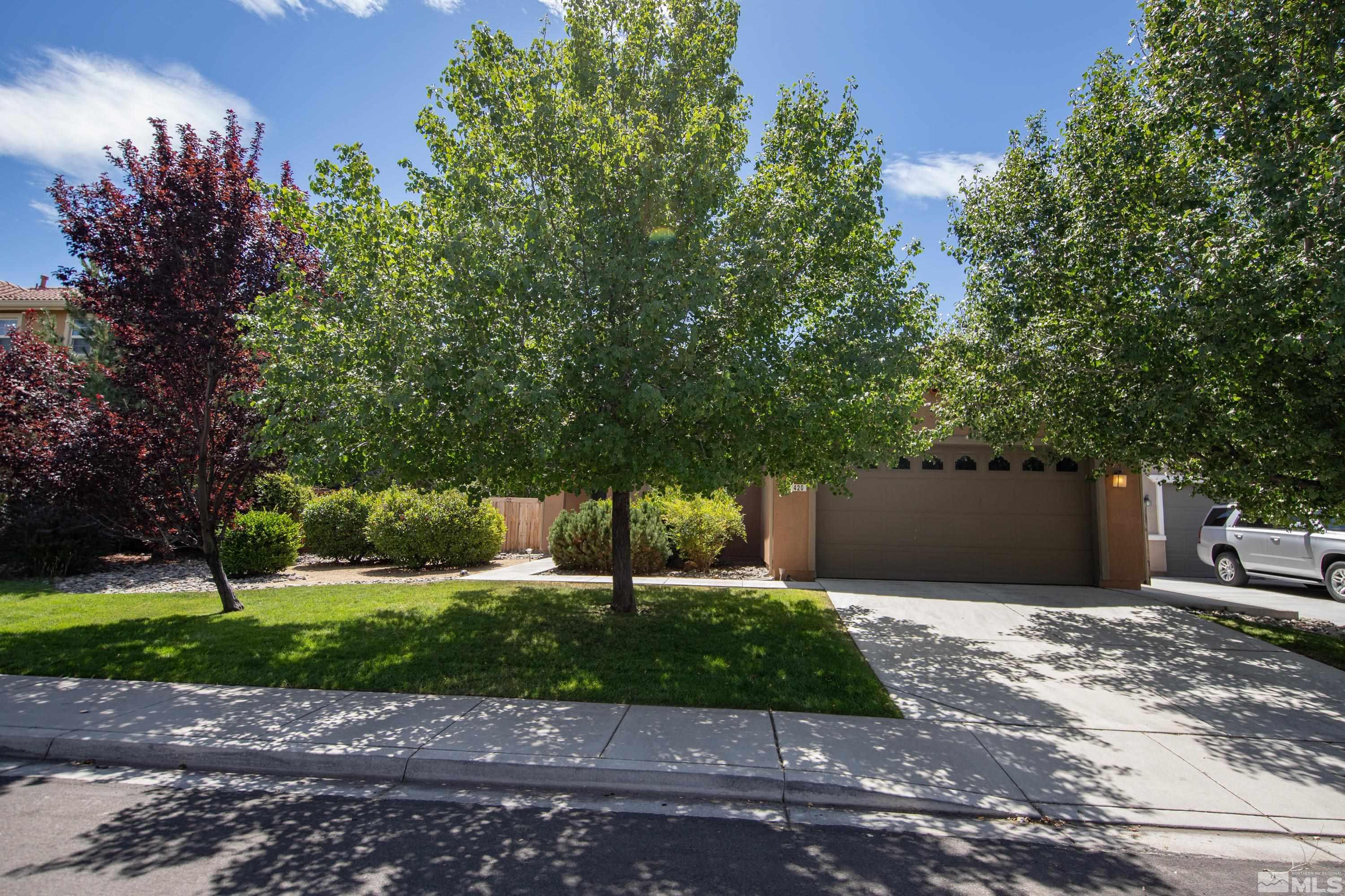 420 Manciano Way Reno, NV 89521 - Photo 2 of 30 a front view of a house with a yard