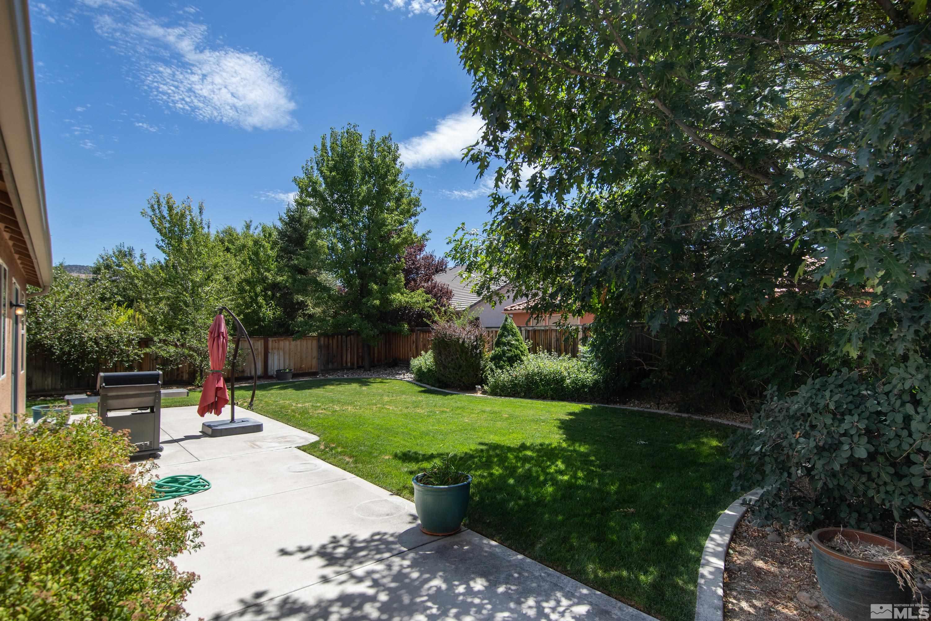 420 Manciano Way Reno, NV 89521 - Photo 24 of 30 a park view with potted plants and large trees
