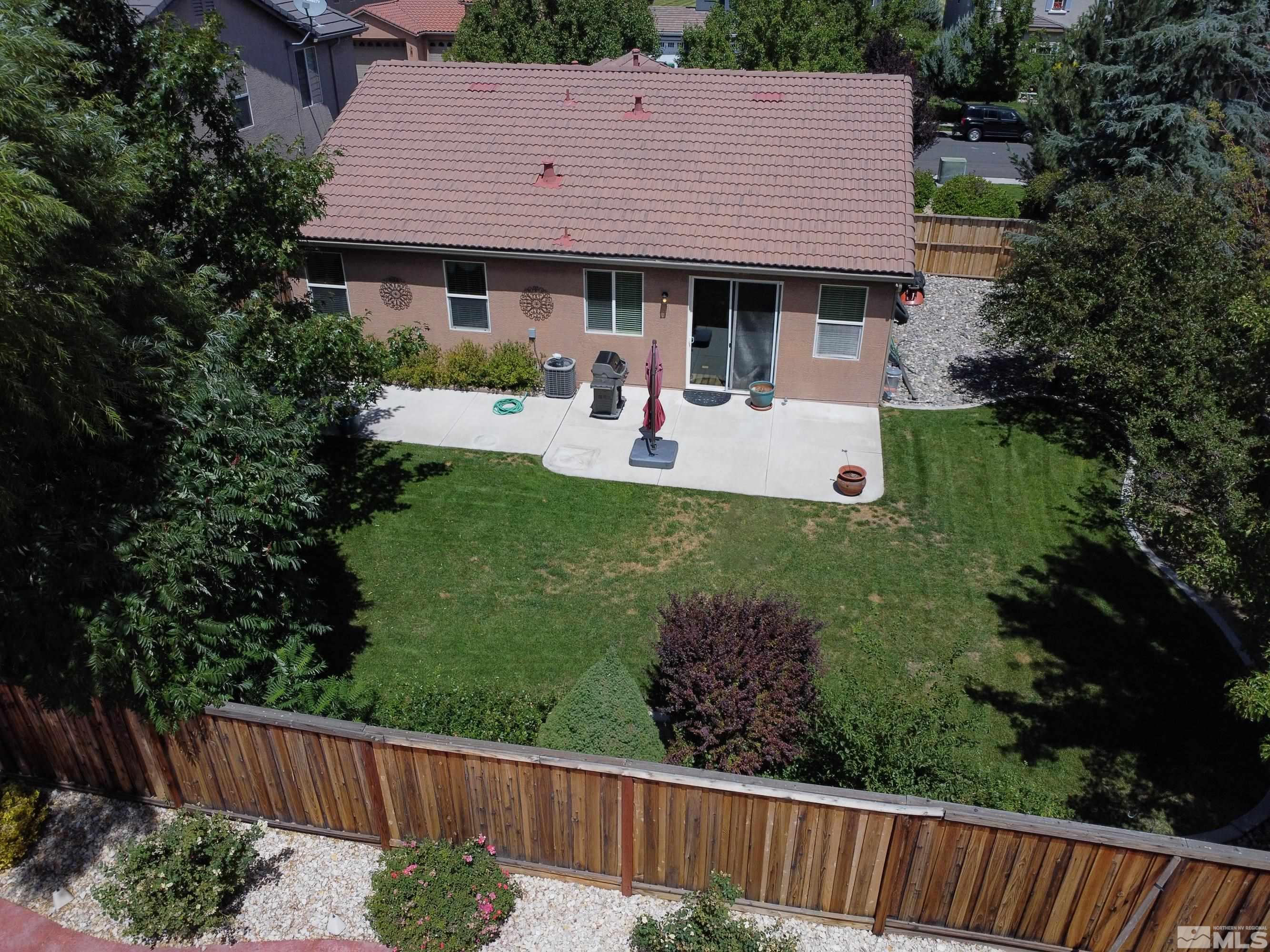 420 Manciano Way Reno, NV 89521 - Photo 28 of 30 a view of a house with a yard and furniture