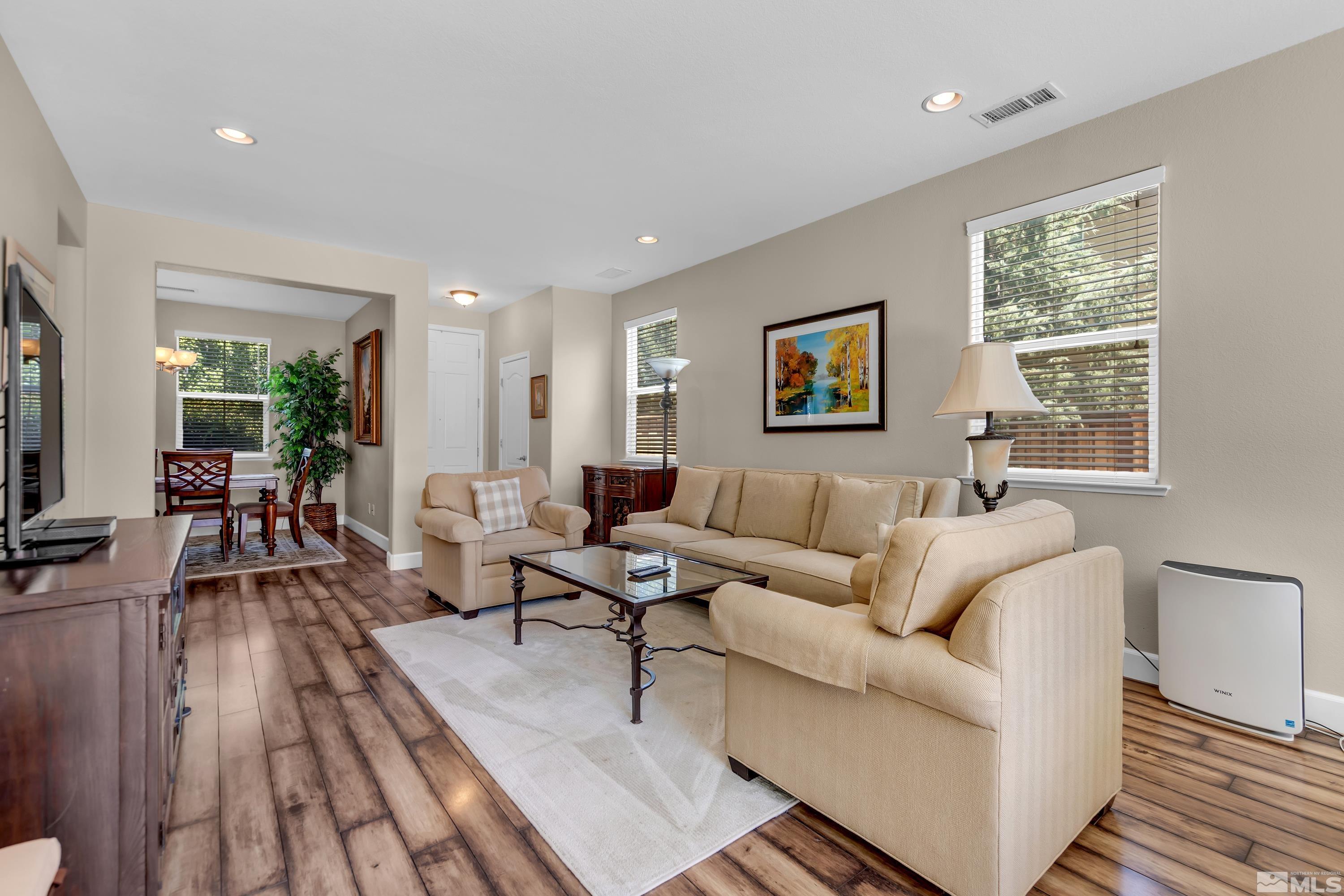 420 Manciano Way Reno, NV 89521 - Photo 6 of 30 a living room with furniture wooden floor and a flat screen tv